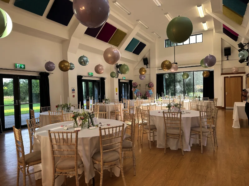 Wedding Tables in hall with whicker chairs